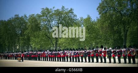 A general view of the 91 members of seven military units that joined forces to break the Guinness World Record for the longest line of a fanfare trumpeters at Wellington barracks, central London. Stock Photo