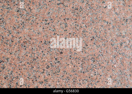 Surface of the walls with light pink granite with brown, gray and white patches. Stock Photo