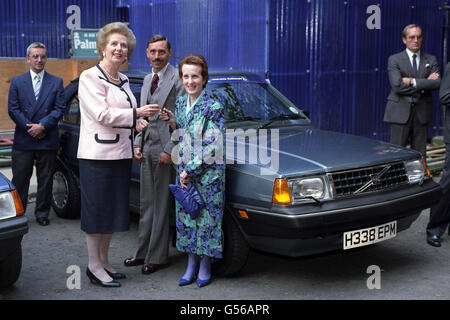 Prime Minister of the United Kingdom Margaret Thatcher presents car keys for a new Volvo to a disabled driver in Downing Street Stock Photo