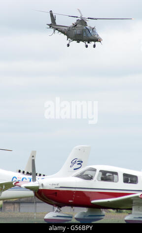 Cosford, UK. 19th June, 2016.  Red Arrows, Apache and Chinook helicopters, Typhoon and the Battle of Britain Memorial flight along with ground display’s were the attractions at the annual RAF Air Show, due to bad weather the RAF Falcons and the USAF B-52 Stratofortress were unable to make a show. Credit: Clifford Norton/Alamy Live News Stock Photo