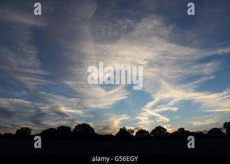 Epsom, Surrey, England, UK. 20th June 2016. As the sun sets on the summer solstice, unusual cloud formations fill the sky to the west. Credit:  Julia Gavin UK/Alamy Live News Stock Photo