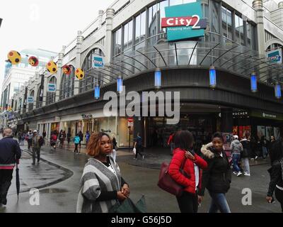 Brussels, Belgium. 21st June, 2016. People walk in front of the City 2 shopping complex in central Brussels, Belgium, June 21, 2016. A bomb alert in a shopping mall in Brussels on Tuesday seemed to be a hoax after a bomb squad found no explosives on site, Belgian broadcaster RTBF reported. Credit:  Gong Bing/Xinhua/Alamy Live News Stock Photo