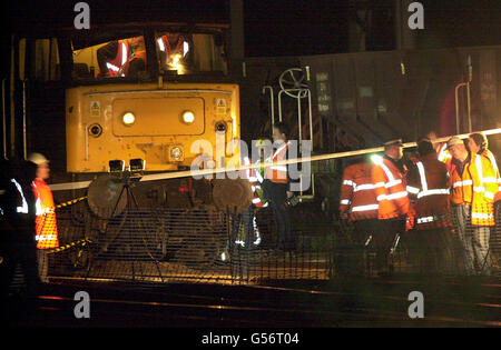Railway staff and engineers attend the scene of a train derailment in Stafford, two days after another derailment in Hatfield which claimed four lives. No one was injured in the derailment at 17.43pm, just south of Stafford station when the locomotive and front two carriages of the 16.47pm Virgin Cross Country train from Birmingham New Street to Manchester Piccadilly went off the rails. Stock Photo