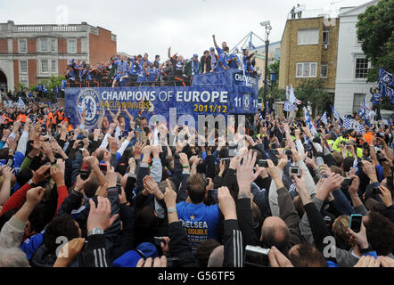 Chelsea players on the bus during the FA Cup and UEFA Champions League trophy parade in London. Stock Photo