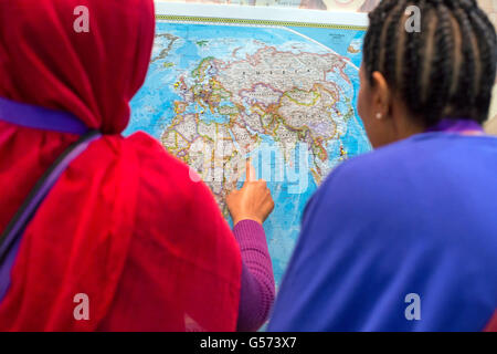 Detroit, Michigan - Delegates to the SEIU convention place pins in a map showing where their families came from. Stock Photo