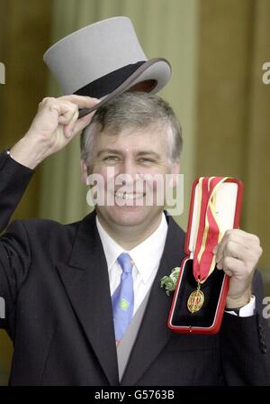 Nicholas Young, chief executive of the charity Macmillan cancer relief, after he received his Knighthood from Queen Elizabeth II at London's Buckingham Palace. Stock Photo