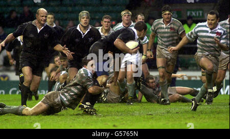 Oxford's Werner Gey van Pittius (centre foreground) is tackled by a Cambridge player, during their Varsity rugby union match for The Bowring Bowl, at Twickenham Stock Photo