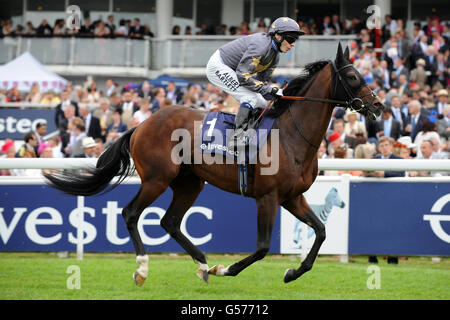 Horse Racing - Investec Derby Festival - Day One - Investec Ladies' Day - Epsom Racecourse. Marcret ridden by jockey Jamie Spencer goes to post in The Investec Diomed Stakes Stock Photo
