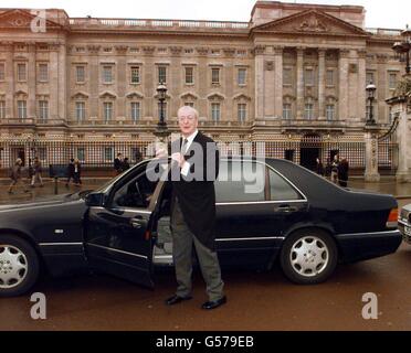 Actor Michael Caine outside Buckingham Palace in London before receiving his knighthood from Britain's Queen Elizabeth II. Caine was knighted as Sir Maurice Micklewhite - his real name. *... The Bermondsey-born son of a Billingsgate fish porter and London charwoman remains a prolific movie actor whose portrayals include the bespectacled Harry Palmer in the Len Deighton spy thrillers, Cockney Lothario Alfie Elkins in Alfie, and Charlie Croker in The Italian Job. Stock Photo