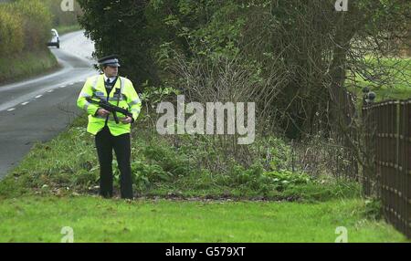 Armed police guard outside Chequers, the British Prime Minister's country residence. The cabinet are attending a strategy meeting at the house in Buckinghamshire to prepare their strategy for the next general election. Stock Photo