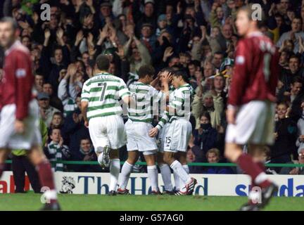 Celtic players celebrate Lubo Moravcik's goal during the Scottish Premier League match against Hearts at Celtic Park, Glasgow. Stock Photo