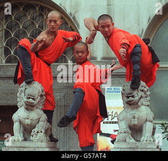 Members of the Shaolin Monks in action as they launch the video of their Wheel of Life Kung Fu tour in central London. The 25 Buddhist soldier monks from China are already touring the UK demonstrating their skills which include acrobatic displays. * and breaking iron blades across their heads. Stock Photo