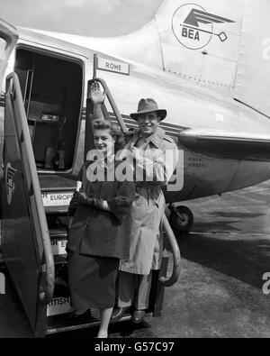 American actors Humphrey Bogart and his wife Lauren Bacall, board a BEA Viking for Rome at Heathrow Airport. Stock Photo