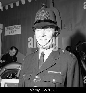 DIXON OF DOCK GREEN : There is something different about this picture of TV's popular 'PC Dixon of Dock Green', played by Jack Warner. He is not wearing the Metropolitan Police helmet but the type worn by the City of London Police. Jack donned the helmet during a recruitment drive at Bishopsgate Police station. Stock Photo