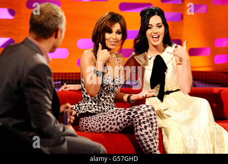 (Left - right) Host Graham Norton, Cheryl Cole and Katy Perry during filming of the Graham Norton show at the London Studios, London. Stock Photo