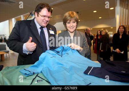 Health Secretary Nicola Sturgeon talks to Director of Nursing Rory Farrelly (l) during a visit to the New Stobhill Hospital in Glasgow to launch of the new NHS Scotland national uniforms Stock Photo