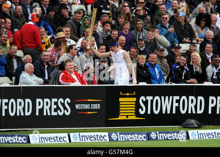 Cricket - 2012 Investec Test Series - Third Test - England v West Indies - Day Three - Edgbaston. A fan dressed as an Olympic Torchbearer makes his way in front of the stands at Edgbaston Stock Photo