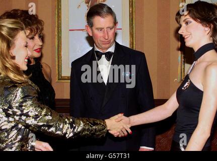 Australian singer Kylie Minogue (L) with Dame Shirley Bassey (2nd L), and harpist Catrin Finch (R) as the Prince of Wales looks on, following the Royal Variety Performance at the Dominion Theatre, in London. * A host of celebrities attended the annual fundraising event including singers Ronan Keating and Lionel Richie. Stock Photo