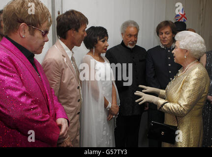 Queen Elizabeth II meets (left to right) Sir Elton John, Sir Cliff Richard, Dame Shirley Bassey, Sir Tom Jones and Sir Paul McCartney backstage at The Diamond Jubilee Concert outside Buckingham Palace, London. Stock Photo