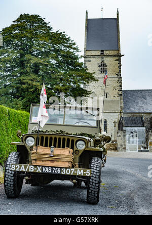 Angoville-au-Plain, Carentan, Normandy, France – A Willys MB truck ¼ ton 4x4 Jeep fitted in ambulance fit outside the church Stock Photo