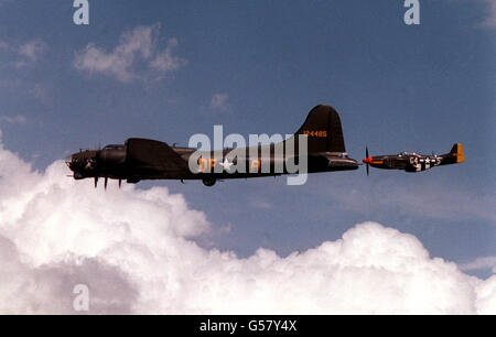 B-17 AND MUSTANG: B-17G Flying Fortress 'Sally B', which appeared as 'Memphis Belle', escorted by a P-51 Mustang as they arrive at Wroughton Airfield, nr Swindon, Wiltshire, for the Great Warbirds Air Display 1992. Stock Photo