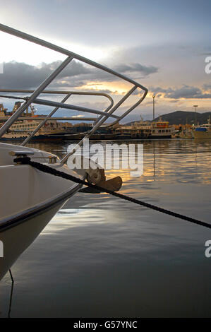 Cloudy sunset at sport port Marina Botafoch, of Ibiza, Spain, with sailboats and fishing boats in view Stock Photo