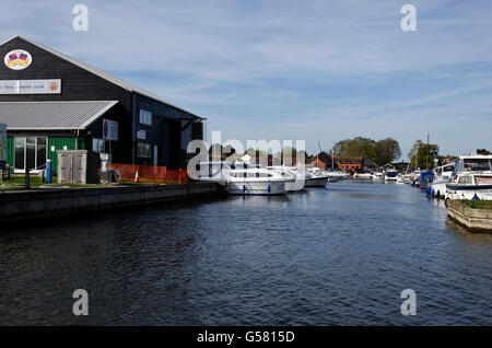 Boatyards on a backwater inlet at Horning on the River Bure in the Norfolk Broads, England. Stock Photo