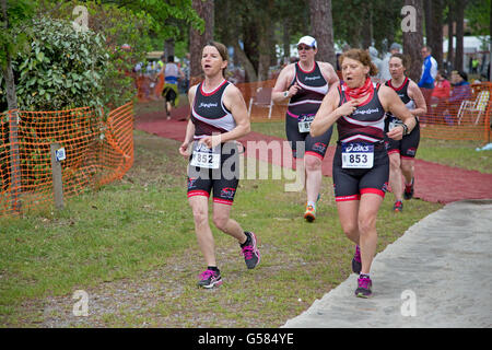 Team of women runners competing in Triathlon of Mimizam France Stock Photo