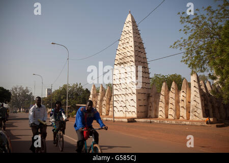 Traffic moves passed the Grand Mosquée in Bobo-Dioulasso, Burkina Faso's second-largest city. Stock Photo