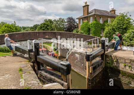 Closing the lock gates at Stockers Lock on the Grand Union Canal London England UK Stock Photo