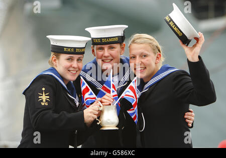 (left to right) Able Seamen Luena Thomas, Iona Manning and Holly Cole from HMS Diamond share a new cocktail, the Dukes Royal Navy Jubilee, during a street-party aboard the ship in Portsmouth Harbour after firing a 21 gun salute to officially launch celebrations to mark the Queen's Diamond Jubilee this weekend. Stock Photo