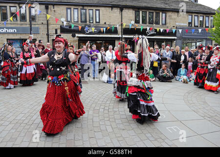 Members of 400 Roses dance troop dancing in St George's Square, Hebden Bridge Stock Photo