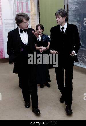 Sir Bob Geldof (R) is shown round 'Oscar Wilde, a life in six acts' an exhibition by Wilde's grandson, Merlin Holland, at the new British Library. It is the centenary anniversary of the Irish playwright and wit Oscar Wilde, who died in Paris on 30/11/1900. Stock Photo