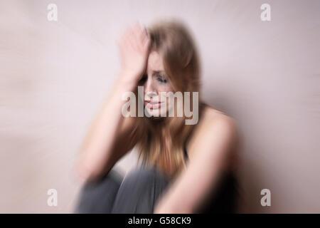 sad depressed young woman with tear-stained face Stock Photo