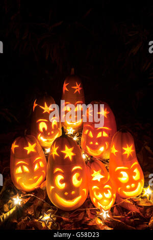 Halloween Lanterns made from home-grown squash with lit candles inside. Stock Photo