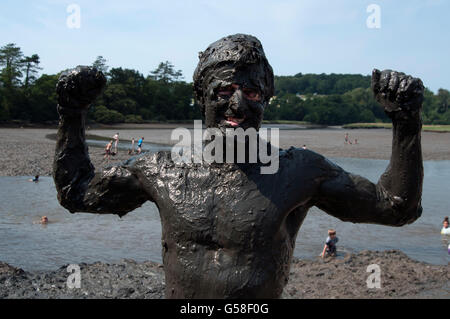 Naked man covered in mud Stock Photo - Alamy