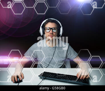 man in headset computer over hexagons projection Stock Photo