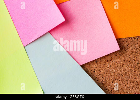 close up of blank paper stickers on cork board Stock Photo