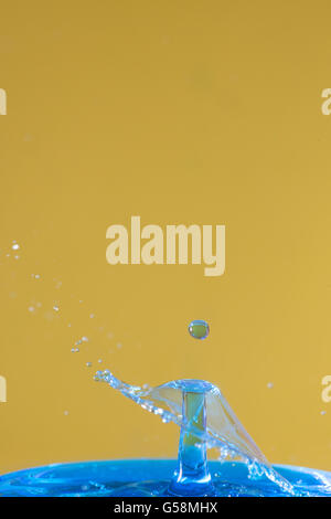 drops falling making splash Stock Photo