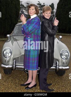 The first Miss Moneypenny, Lois Maxwell (left) and the current Miss Moneypenny, Samantha Bond with the famous silver 1965 Aston Martin DBS from the film Goldeneye during a Christie's sale preview at Stoke Park Club. * The car is expected to fetch between 100,000 - 150,000 during a sale of Bond memorabilia. Stock Photo