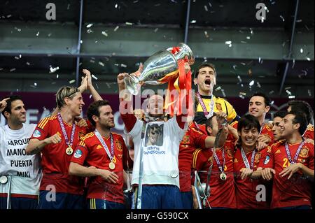 Spain's Sergio Ramos lifts the UEFA European Championship trophy after the final whistle Stock Photo