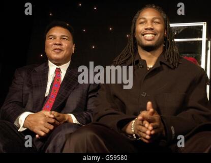 Former Heavyweight Champion Muhammad Ali (left) with current current Heavyweight Champion Lennox Lewis at the launch of the video game 'Knockout Kings 2001', designed for the Playstation2 console and due for release in March 2001, in London. * 21/10/02: Lewis received the ultimate accolade in boxing when he was hailed as The Greatest by heavyweight legend Muhammad Ali. Ali, appearing at a fund-raiser for a Parkinson's Disease charity with Lewis, graciously passed on the mantle he claimed for himself at the height of his powers. 'I was the greatest. I'm now no longer the greatest', he told the Stock Photo