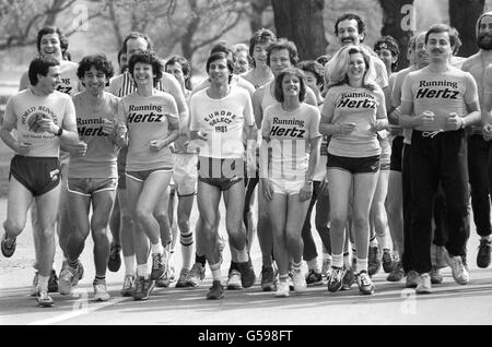 Sebastian Coe (centre), jogging in Hyde Park, London, when he gave advice to a group of people entered in the London Marathon. Stock Photo