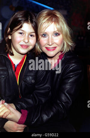 Former Eastenders actress Carol Harrison with her son Alfie at the premiere for the kids film Digimon: The Movie, at Planet Hollywood, in London's West End. Stock Photo