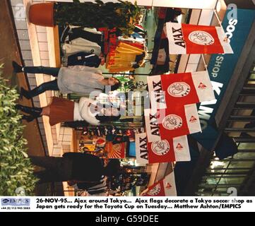 26-NOV-95. Ajax around Tokyo. Ajax flags decorate a Tokyo soccer shop as Japan gets ready for the Toyota Cup on Tuesday. Matthew Ashton/EMPICS Stock Photo