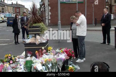 Still taken from PA video of Jamie Heaton's parents, Michelle and Kenny visiting floral tributes in Oldham following Tuesday's massive explosion. Stock Photo