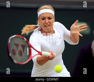 Germany's Sabine Lisicki in action against Russia's Maria Sharapova during day seven of the 2012 Wimbledon Championships at the All England Lawn Tennis Club, Wimbledon. Stock Photo