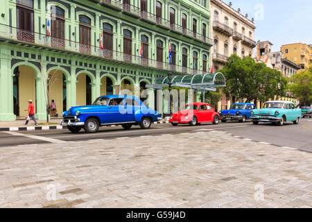 Havana street scene - American classic cars on Paseo di Marti in front of the new Saratoga Hotel, Old Havana, Cuba Stock Photo