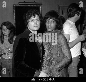 16th SEPTEMBER: Mark Bolan died in a car crash on this day in 1977. Pop star Marc Bolan, of the group T-Rex, and his girlfriend, American singer Gloria Jones, at a party thrown by fellow pop star Rod Stewart, in London. Stock Photo