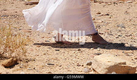 Walking in desert - woman's feet Stock Photo